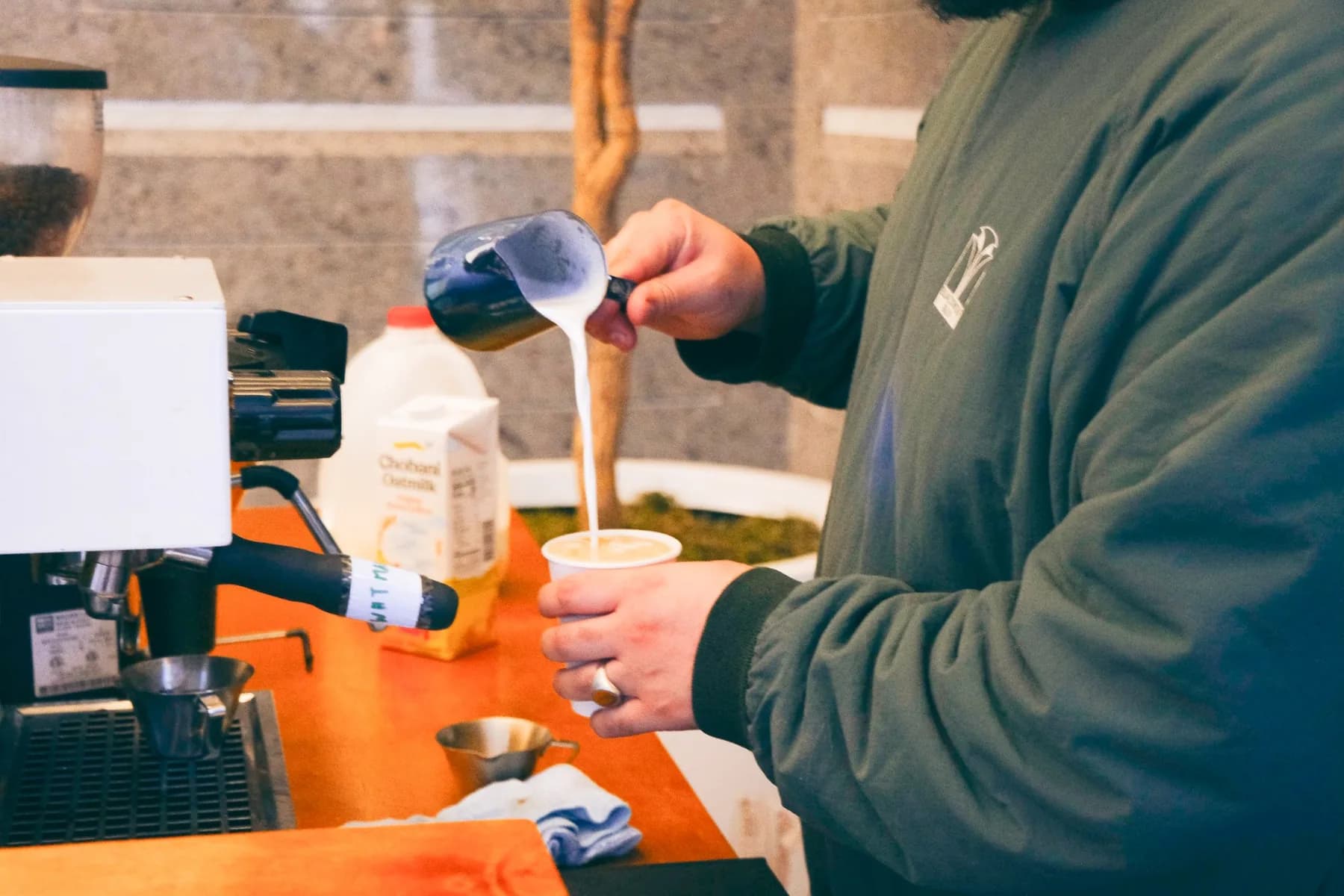 Barista Pouring Steamed Milk for Latte Art at Hines Coffee Social