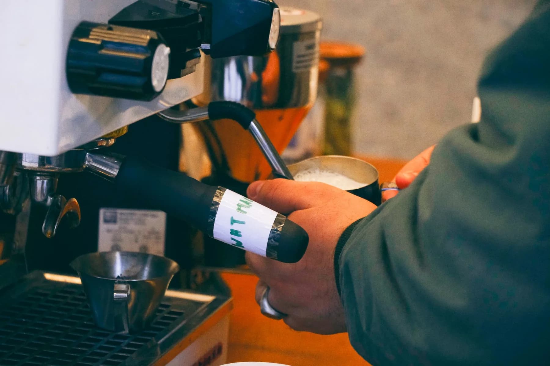 Barista Steaming Milk for Coffee at Hines Coffee Social