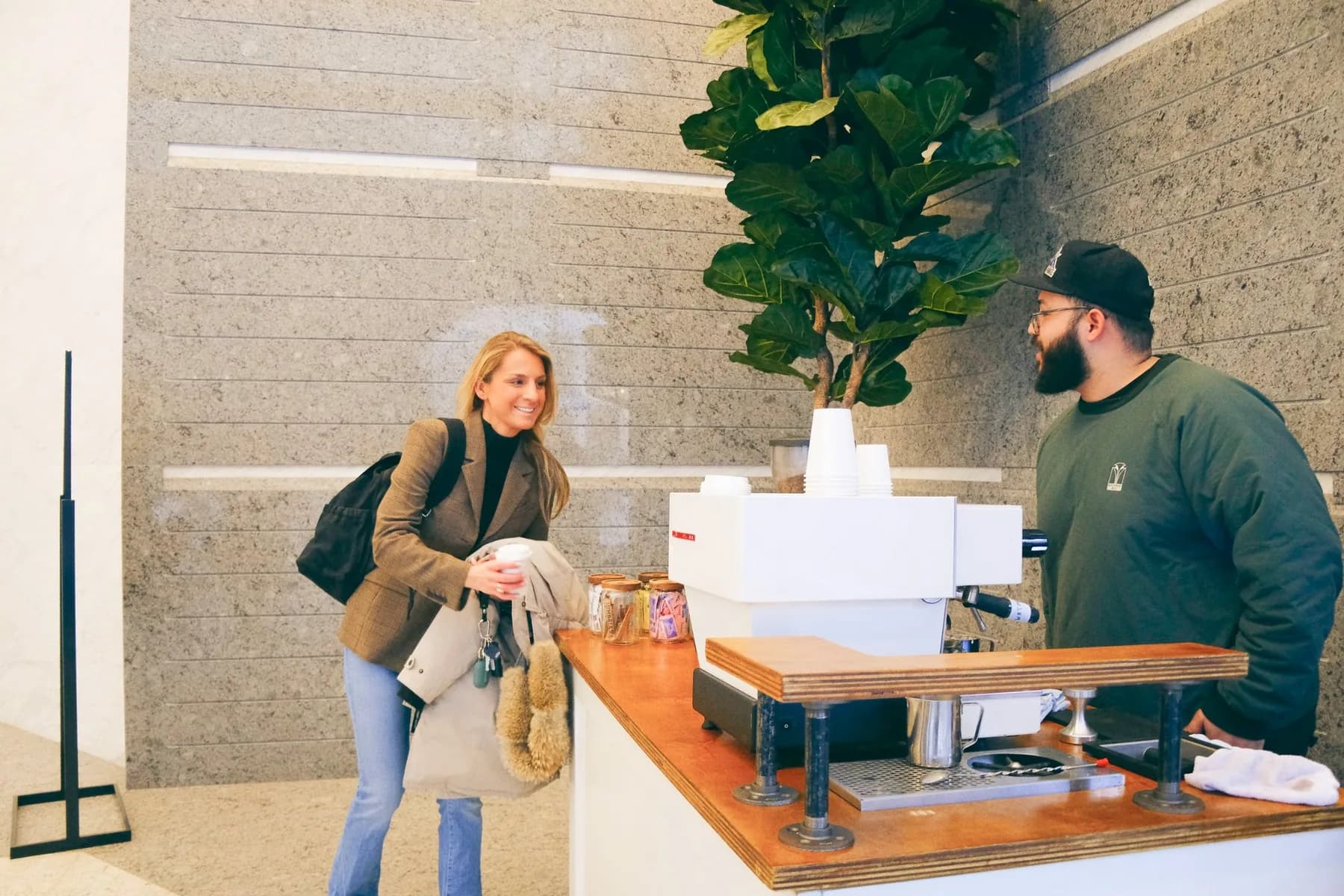 Smiling Guest Receiving Coffee at Hines Coffee Social